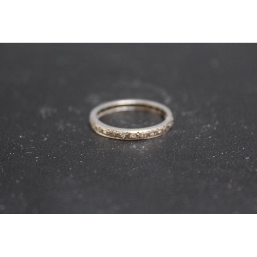 698 - A DIAMOND ETERNITY RING, set in unmarked white metal - possibly platinum, approx weight 3.7g, ring s... 