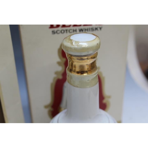 910 - FOUR COMMEMORATIVE ROYAL BELL'S WHISKY IN CERAMIC DECANTERS, two being 50cl, two being 75cl, packagi... 