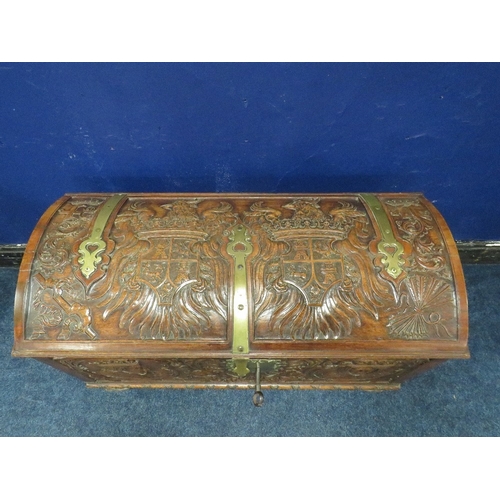 1156 - A DOMED 18TH CENTURY CARVED OAK COFFER WITH ORIGINAL KEY, the domed carved top with armorial detail,... 