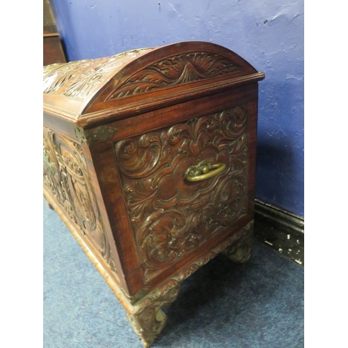 1156 - A DOMED 18TH CENTURY CARVED OAK COFFER WITH ORIGINAL KEY, the domed carved top with armorial detail,... 