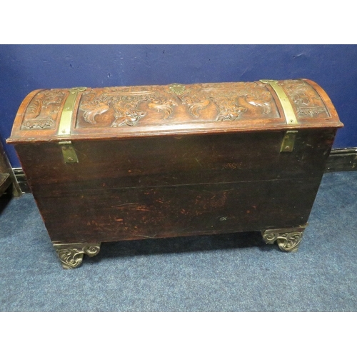 1156 - A DOMED 18TH CENTURY CARVED OAK COFFER WITH ORIGINAL KEY, the domed carved top with armorial detail,... 