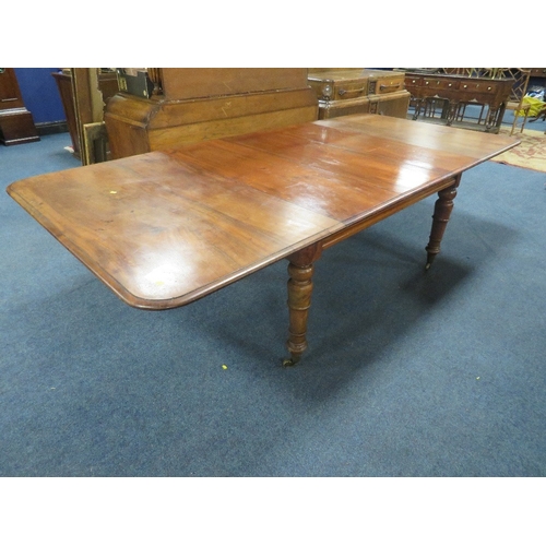 1159 - A MID-VICTORIAN MAHOGANY PULL-OUT EXTENDING DINING TABLE, having three additional leaves, raised on ... 