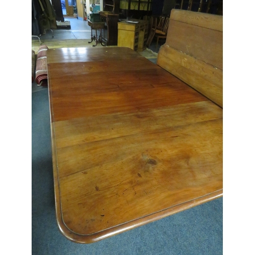 1159 - A MID-VICTORIAN MAHOGANY PULL-OUT EXTENDING DINING TABLE, having three additional leaves, raised on ... 