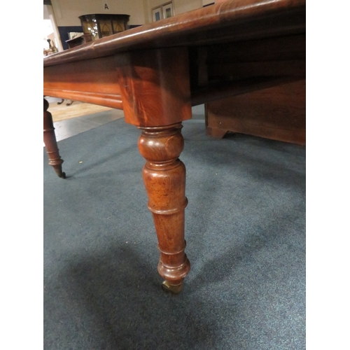 1159 - A MID-VICTORIAN MAHOGANY PULL-OUT EXTENDING DINING TABLE, having three additional leaves, raised on ... 