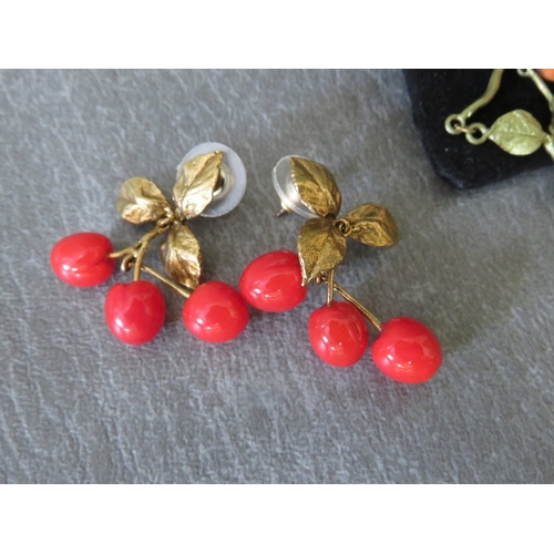 622 - MICHAEL MICHAUD - A 'CHERRY' THEMED BRACELET, plus a pair of matched earrings, together with two fur... 