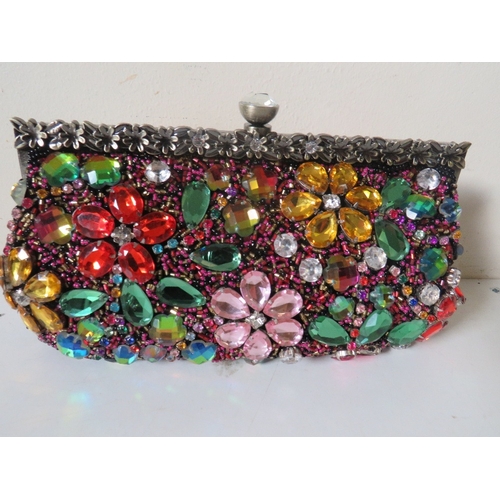 553 - FOUR HEAVILY BEADED / EMBELLISHED BUTLER AND WILSON EVENING BAGS