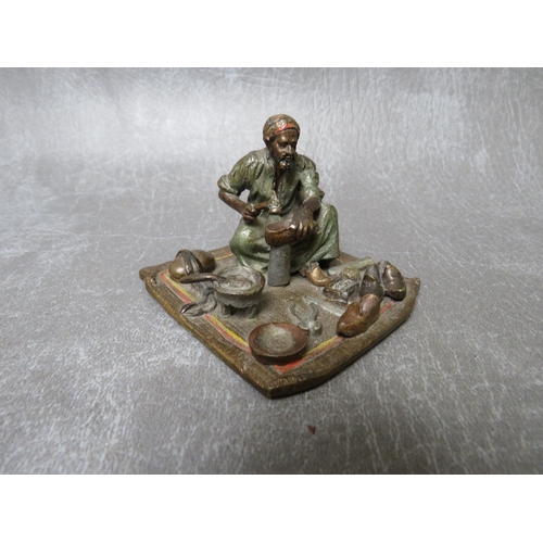 864 - A 19TH CENTURY VIENNESE COLD PAINTED BRONZE FIGURE OF AN EASTERN SHOEMAKER, H 5 cm, base 7 x 6.5 cm