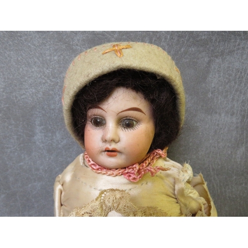 570 - A 19TH CENTURY PORCELAIN BODIED DOLL, with horseshoe mark to nape of neck