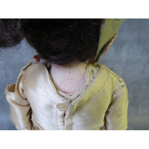 570 - A 19TH CENTURY PORCELAIN BODIED DOLL, with horseshoe mark to nape of neck