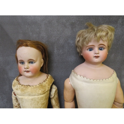 571 - TWO LATE 18TH / 19TH CENTURY HIDE BODIED DOLLS, one marked 312 / 8, one in need of some restoration