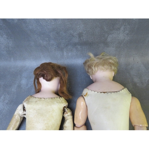 571 - TWO LATE 18TH / 19TH CENTURY HIDE BODIED DOLLS, one marked 312 / 8, one in need of some restoration