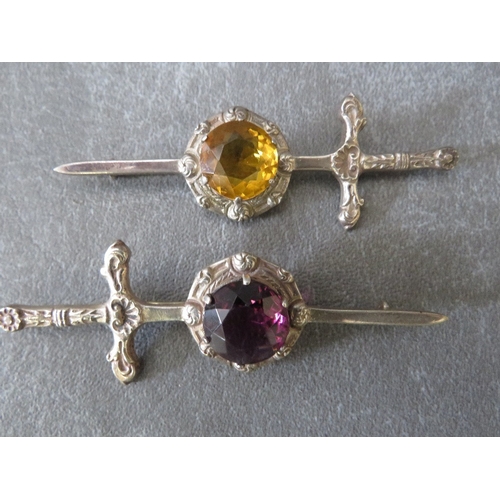 615 - TWO HALLMARKED SILVER GEM SET KILT PINS IN THE FORM OF A SWORD, a marcasite ring marked 800, a hallm... 