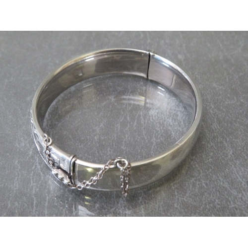 616 - GEORG JENSEN - HALLMARKED SILVER HINGED BANGLE, with foliate decoration to one side, makers mark GJL... 