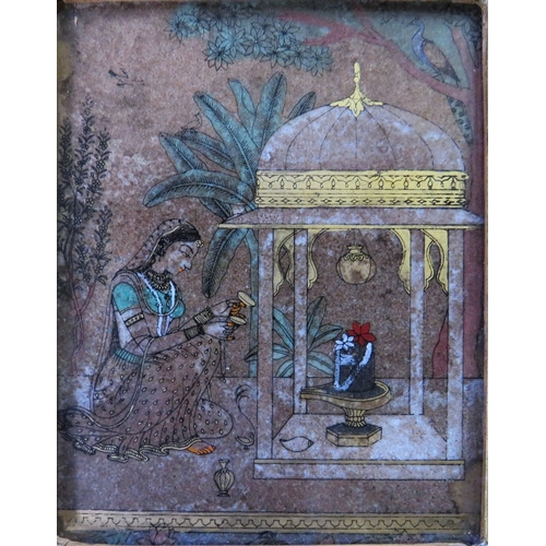 410 - A 19TH CENTURY INDIAN SCHOOL REVERSE PAINTING ON GLASS, depicting a seated figure by a temple, unsig... 