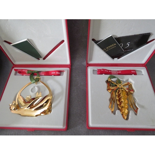 554 - GEORG JENSEN - A COLLECTION OF FIVE BOXED CHRISTMAS ORNAMENTS,  comprising 1998, 1994, two x 2004 an... 