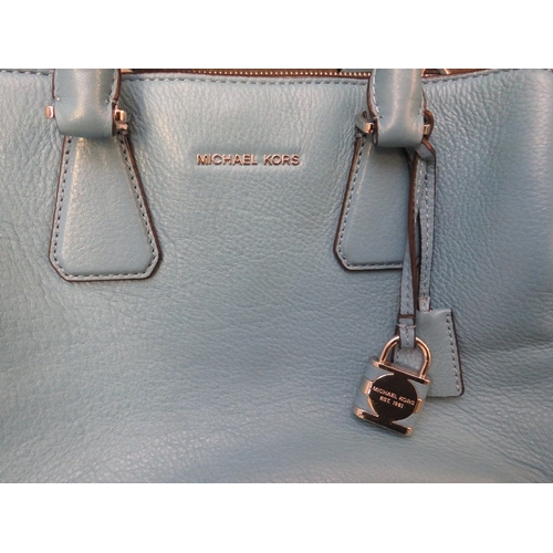 560 - A MICHAEL KORS WEDGWOOD BLUE LEATHER HAND BAG, with twin carry handles and detachable shoulder strap... 