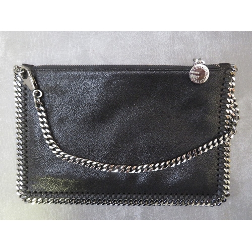 562 - A BOXED STELLA McCARTNEY BLACK LEATHER POUCH TYPE EVENING BAG, gunmetal colour hardware, H 16 cm, W ... 