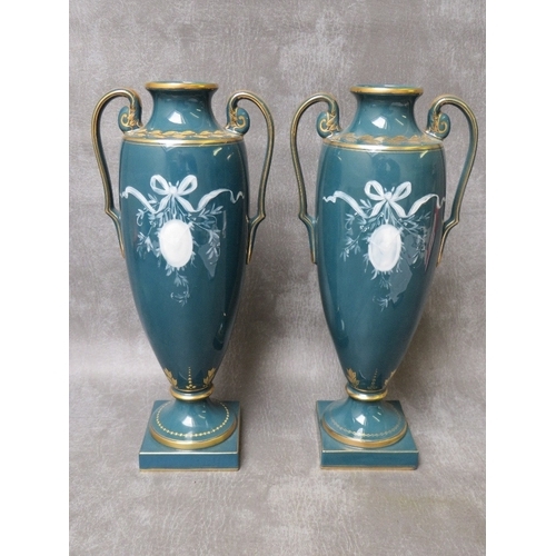 950 - A PAIR OF MINTONS TWIN HANDLED PATE-SUR PATE PORCELAIN VASES, circa 1992, both titled 'Nymph Trainin... 