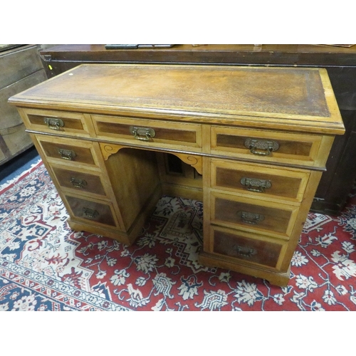 1163 - AN EDWARDIAN AESTHETIC PERIOD TWIN PEDESTAL DESK, with inset tooled leather writing surface, having ... 