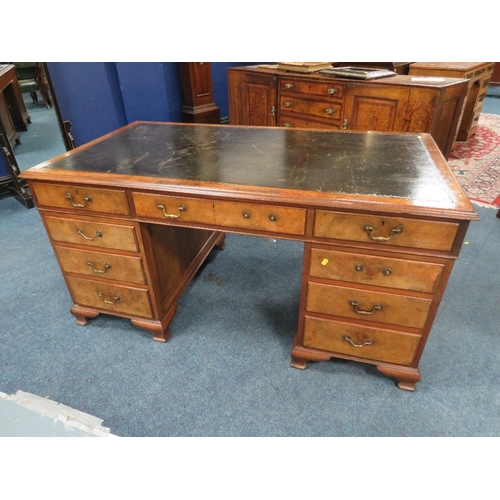 1164 - A 20TH CENTURY WALNUT TWIN PEDESTAL DESK, with inset tooled leather writing surface, having an arran... 