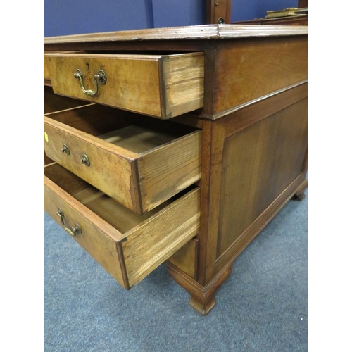 1164 - A 20TH CENTURY WALNUT TWIN PEDESTAL DESK, with inset tooled leather writing surface, having an arran... 