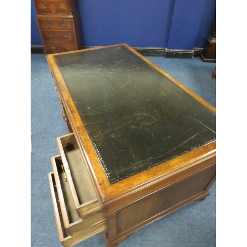 1164 - A 20TH CENTURY WALNUT TWIN PEDESTAL DESK, with inset tooled leather writing surface, having an arran... 