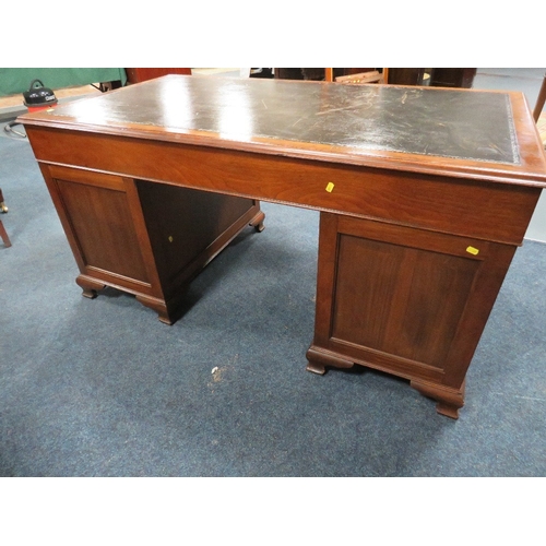 1164 - A 20TH CENTURY WALNUT TWIN PEDESTAL DESK, with inset tooled leather writing surface, having an arran... 