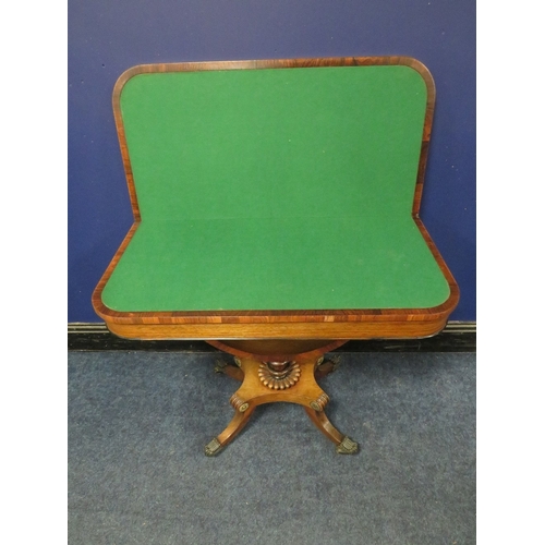 1178 - A REGENCY ROSEWOOD FOLD-OVER CARD TABLE, opening to a green baize surface, raised on a demi-lune sup... 