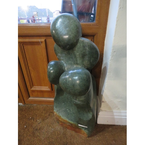 1185 - AN AFRICAN CARVED STONE SCULPTURE DEPICTING THREE FIGURES, H 75 cm