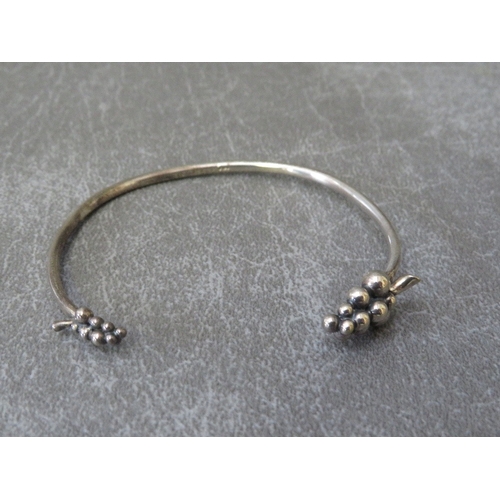 617 - GEORG JENSEN - A MOONLIGHT GRAPES SILVER BANGLE, stamped 925, makers marks indistinct