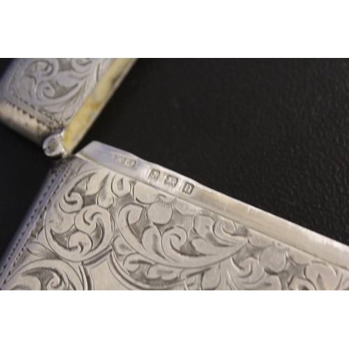 821 - A HALLMARKED SILVER DECORATIVE CARD CASE - BIRMINGHAM 1912, 9 x 6.5 cm