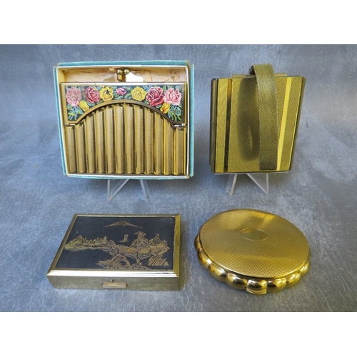 580 - TWO VINTAGE MUSICAL COMPACTS, comprising a shaped Kigu example and a rectangular Clover example, tog... 