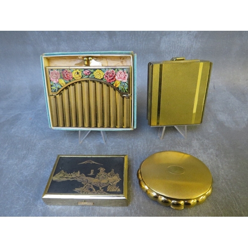 580 - TWO VINTAGE MUSICAL COMPACTS, comprising a shaped Kigu example and a rectangular Clover example, tog... 