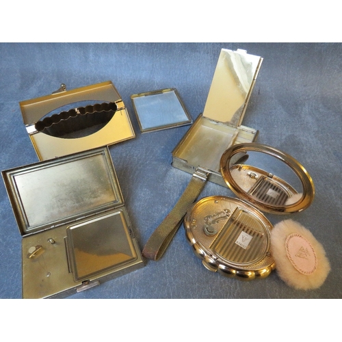 580 - TWO VINTAGE MUSICAL COMPACTS, comprising a shaped Kigu example and a rectangular Clover example, tog... 