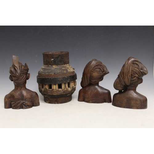 1049 - THREE INDONESIAN TRIBAL ART CARVED TEAL WOOD BUSTS, and a large heavy Indian cartwheel hub