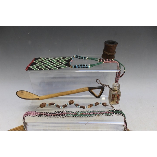 1051 - A COLLECTION OF SOUTH AFRICAN ZULU BEADWORK ITEMS, with a Xhosa nursing necklace, pipes, jewellery, ... 