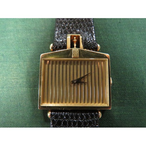 721 - A GENTLEMANS 18K GOLD CORUM ROLLS ROYCE 'SPIRIT OF ECSTASY' WRIST WATCH, in the form of a Rolls Royc... 