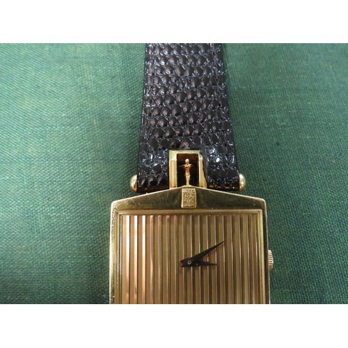 721 - A GENTLEMANS 18K GOLD CORUM ROLLS ROYCE 'SPIRIT OF ECSTASY' WRIST WATCH, in the form of a Rolls Royc... 