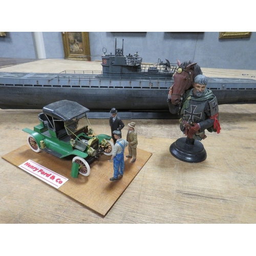 361 - Three plastic models to include a Ford Popular diorama, a large German U-boat and a knight with hors... 