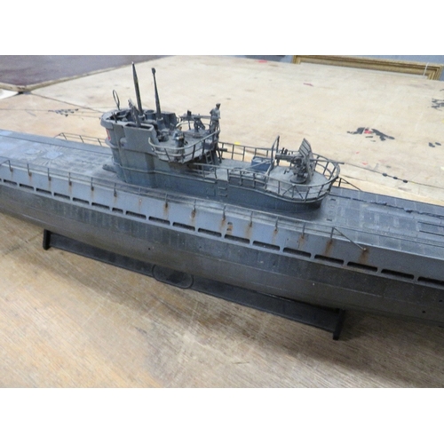 361 - Three plastic models to include a Ford Popular diorama, a large German U-boat and a knight with hors... 