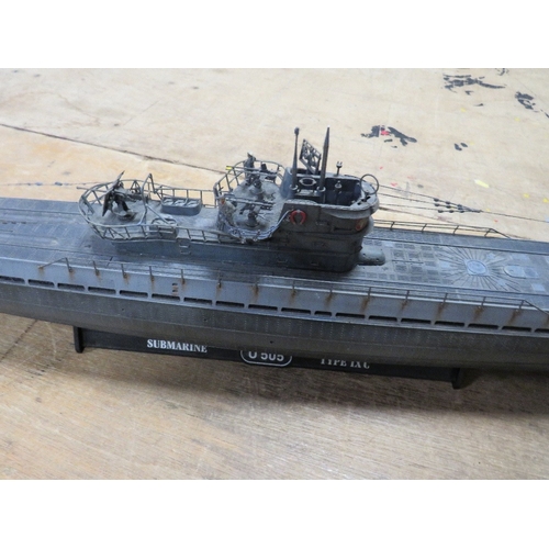 361 - Three plastic models to include a Ford Popular diorama, a large German U-boat and a knight with hors... 