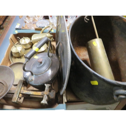 90 - A large cast iron cooking pot together with a tray of metal ware (2)