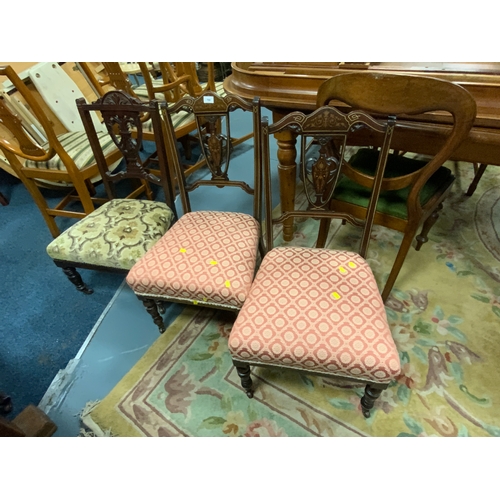 790 - A pair of inlaid rosewood Edwardian chairs together with another chair. (3)