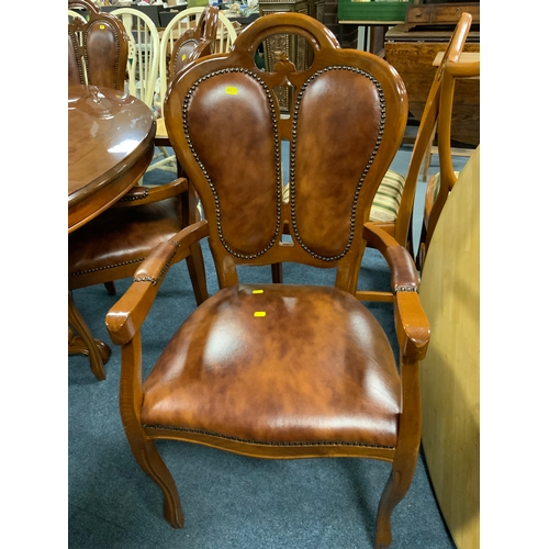 792 - A large reproduction Italian style circular pedestal table with lazy susan and six chairs