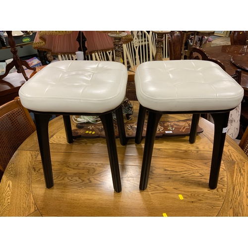 794 - A pair of modern upholstered stools with cream tops