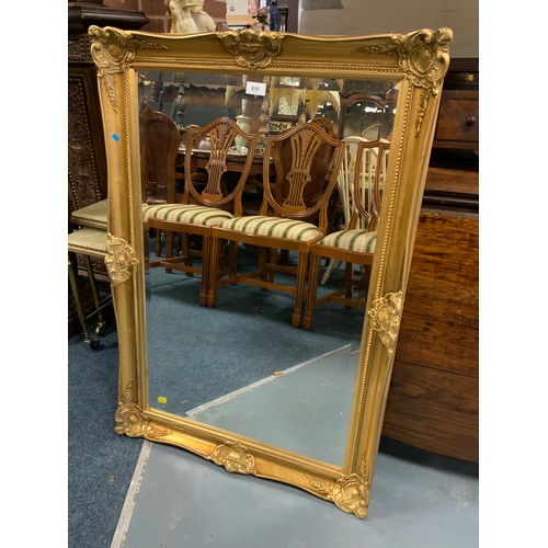 818 - A modern gilt mirror