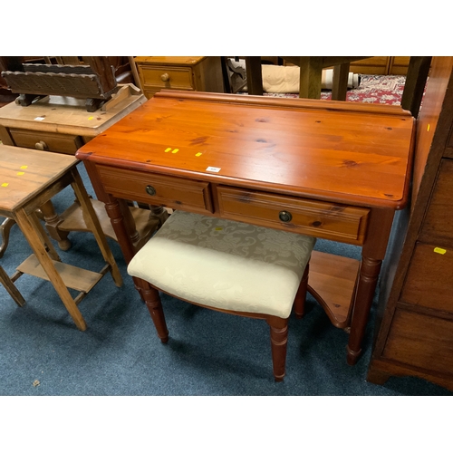 820 - A pine Ducal two drawer desk and stool