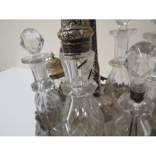 299 - An antique seven bottled cruet some being hallmarked silver topped examples A/F