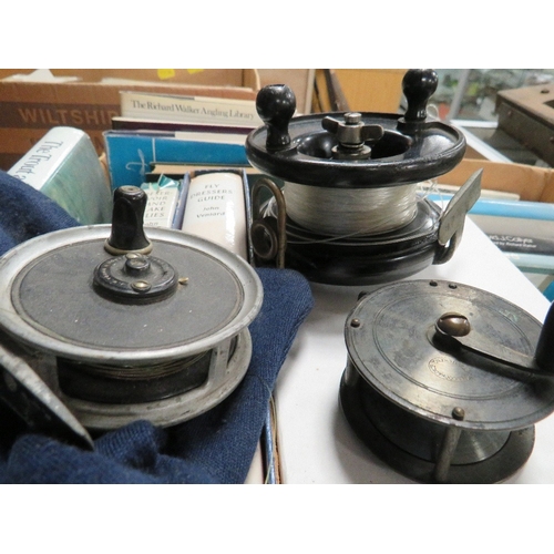 317 - Three vintage fly fishing reels together with a tray of books on fly fishing etc