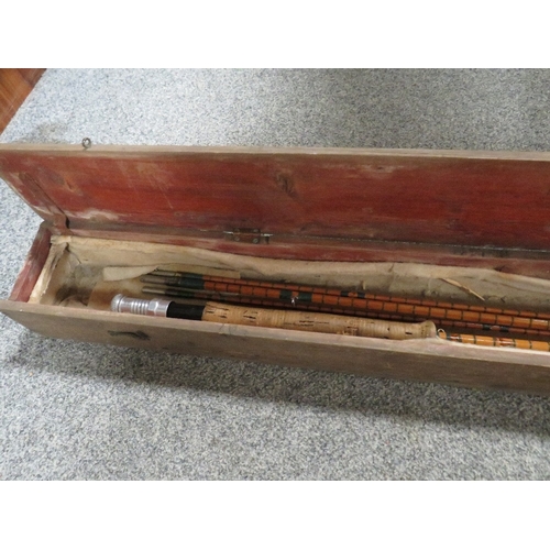 318 - A vintage spilt cane three section fly fishing rod with spare top section in original wooden case